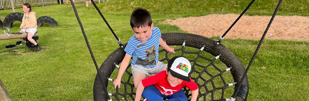 children-on-large-swing Children on large swing