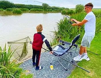 Father and son fishing in the summer